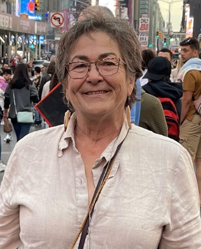 Charlene standing in a crowded street