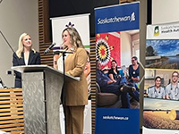 Two women speak at a press conference.